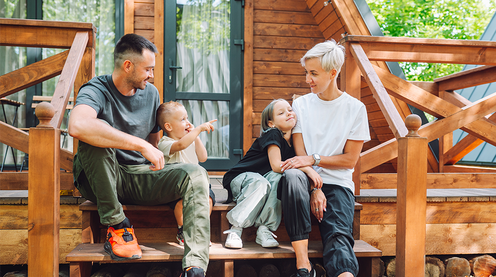 Summer relaxation in glamping: family with children unwinds in glamping cabin during vacation